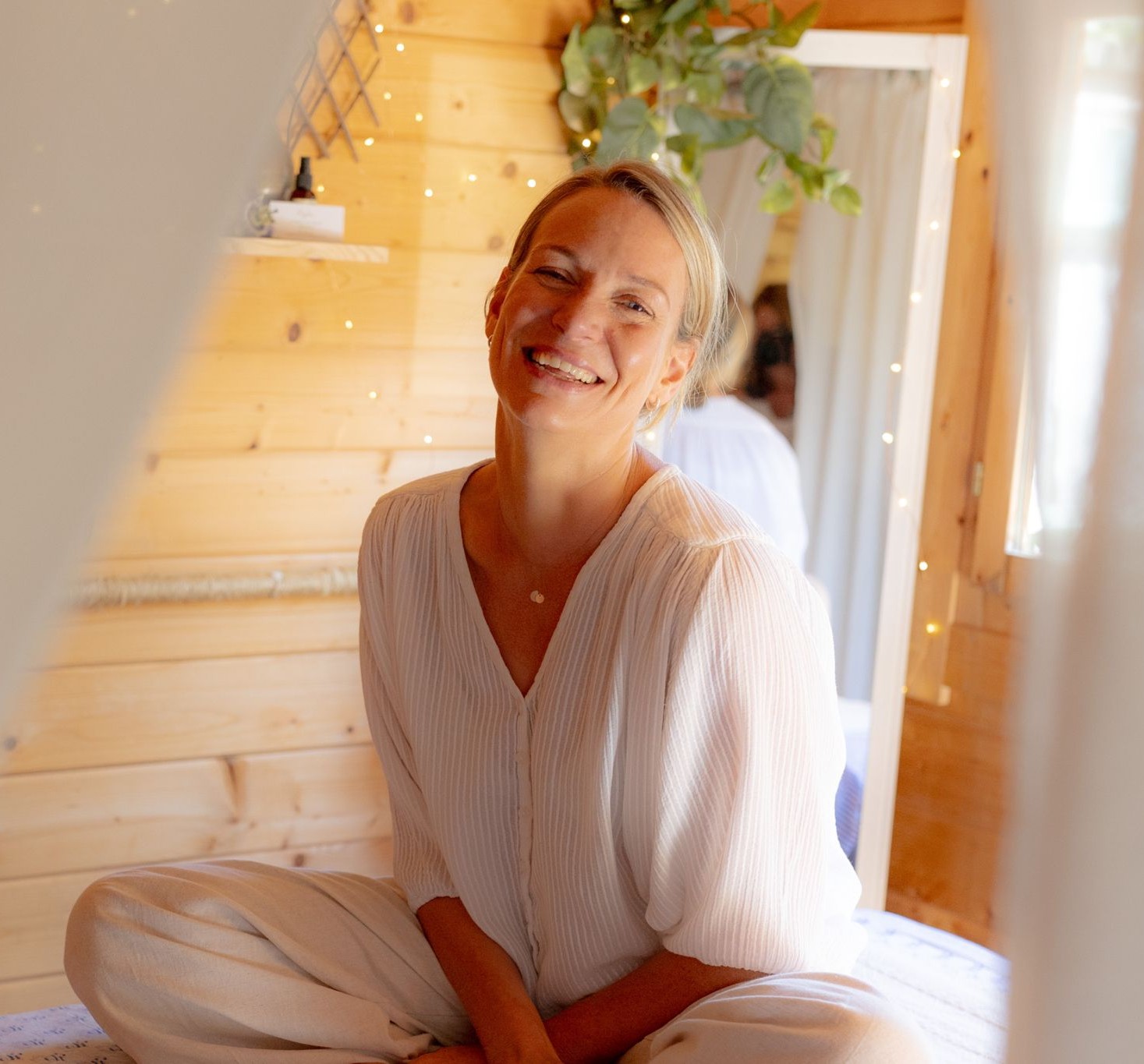 Cara Dawid, a holistic massage therapist, smiling warmly.